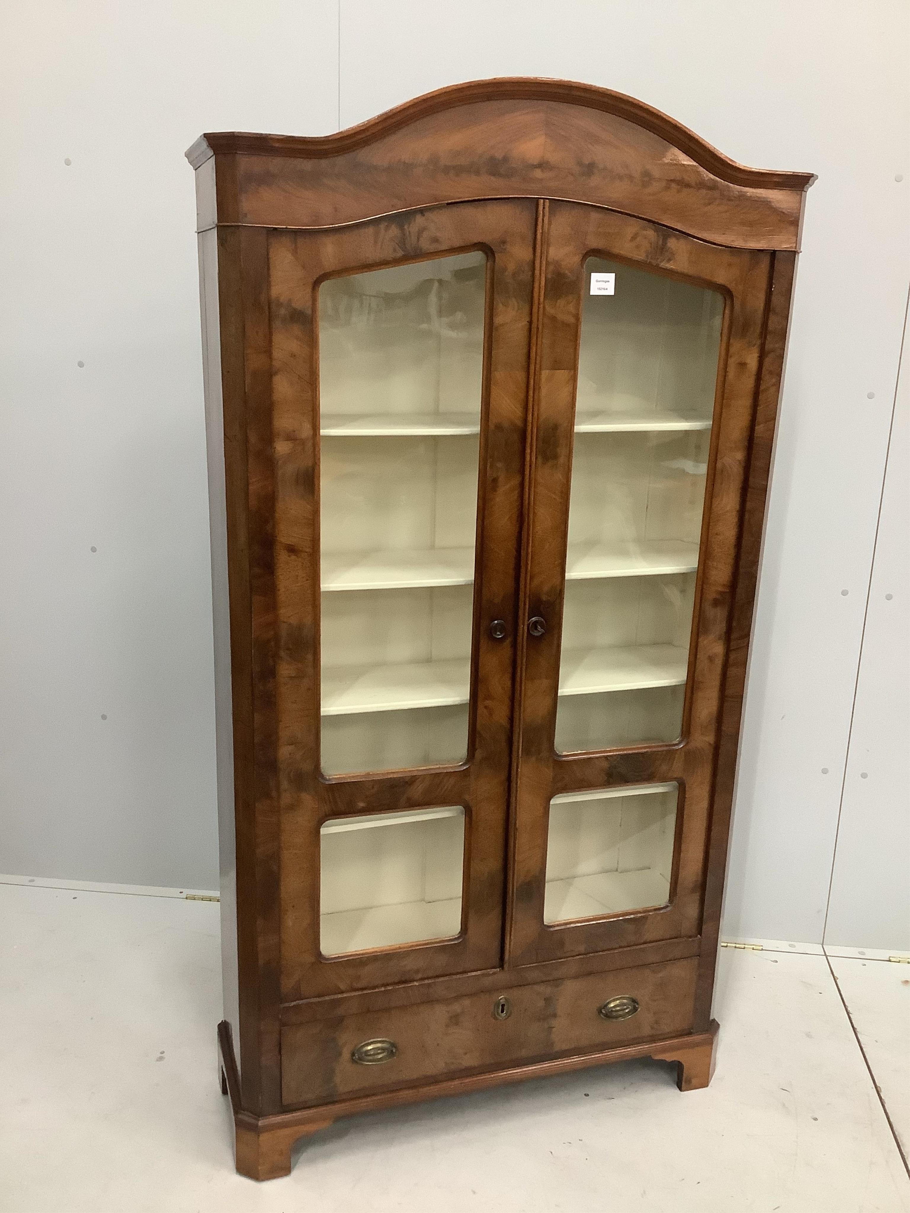 A 19th century German walnut bookcase, width 98cm, depth 31cm, height 181cm. Condition - fair